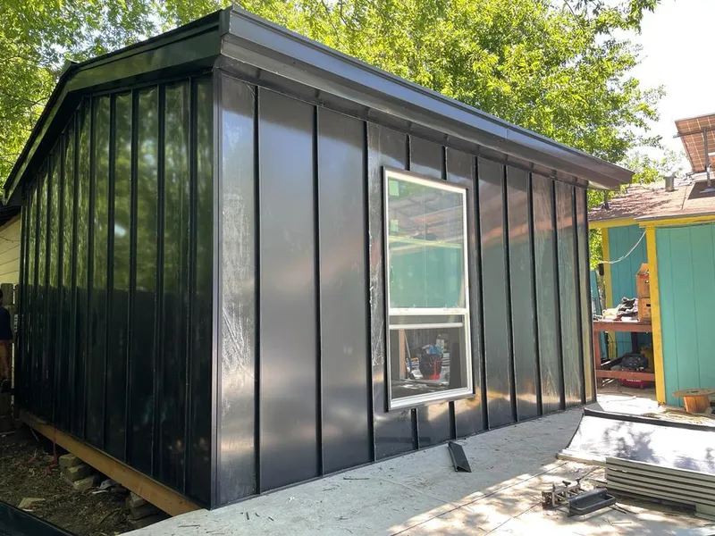 Black standing seam metal wall panels for Roof Inspection in Cary